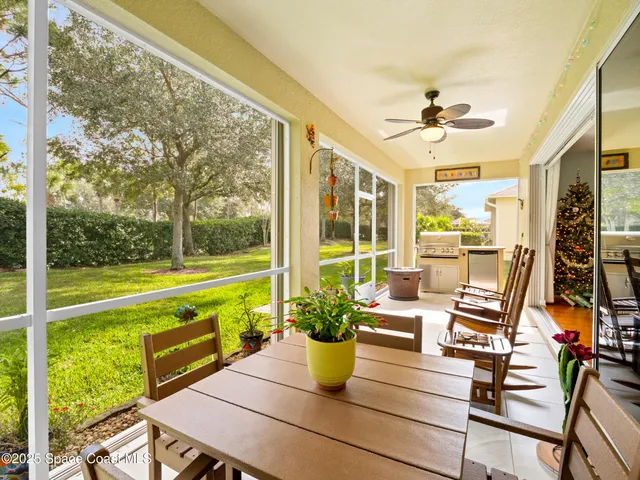 a view of a dining room with furniture window and outside view