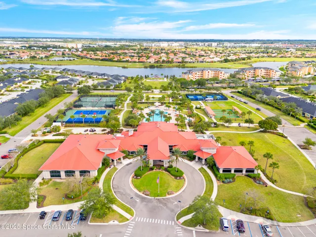 an aerial view of residential houses with yard