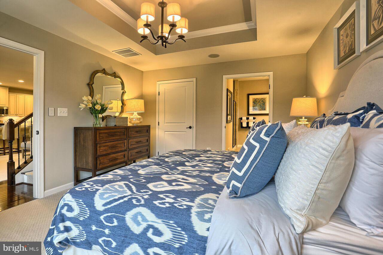 3156 Sunny Ridge Drive Odenton, MD 21113 - Photo 6 of 30 a bedroom with a bed and wooden floor