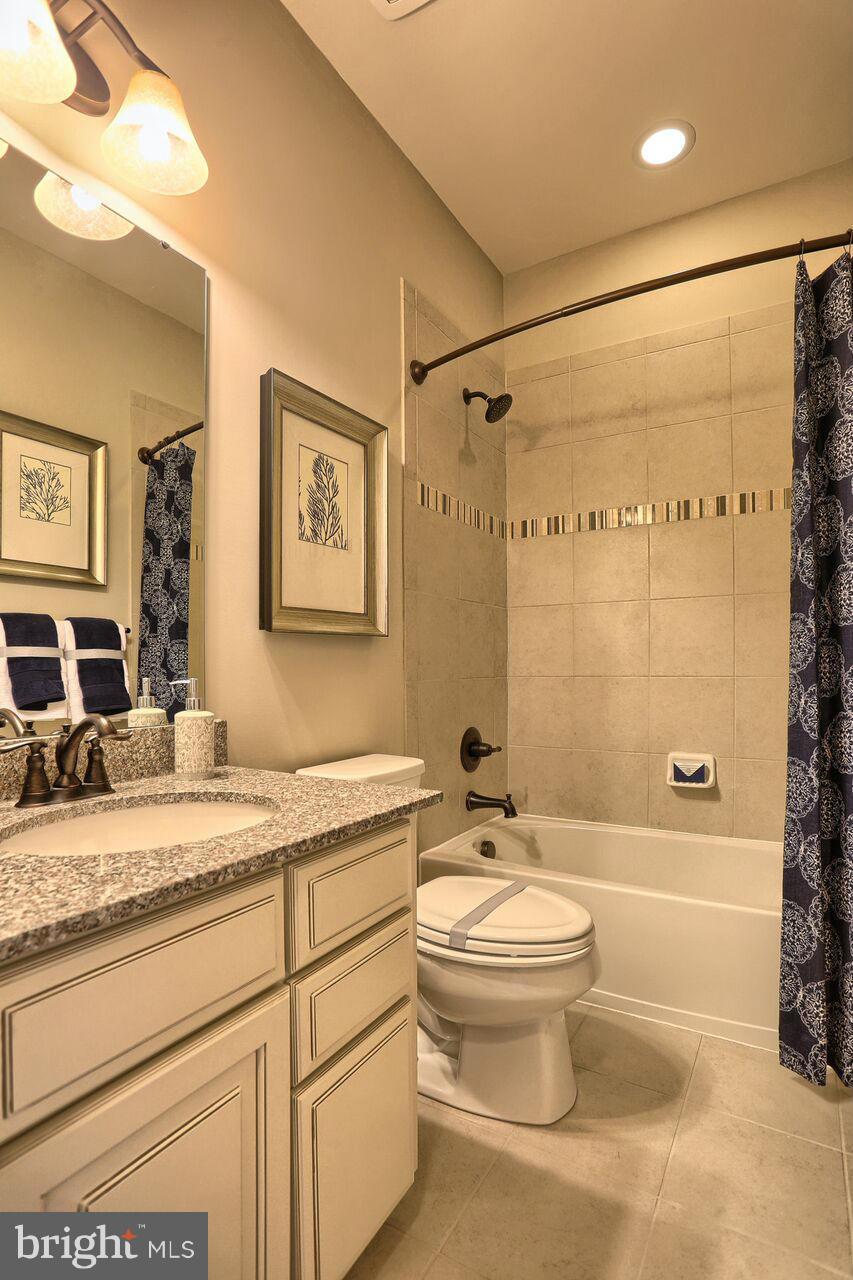 3156 Sunny Ridge Drive Odenton, MD 21113 - Photo 7 of 30 a bathroom with a granite countertop sink toilet and shower