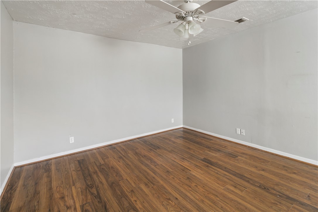 1012-1014 East 23rd Street Bryan, TX 77803 - Photo 11 of 22 a view of an empty room with wooden floor