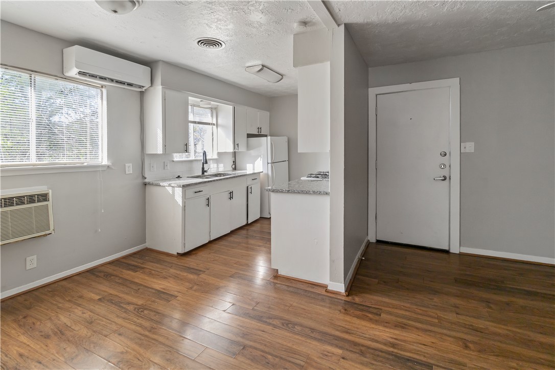 1012-1014 East 23rd Street Bryan, TX 77803 - Photo 22 of 22 a room with a wooden floor and white walls