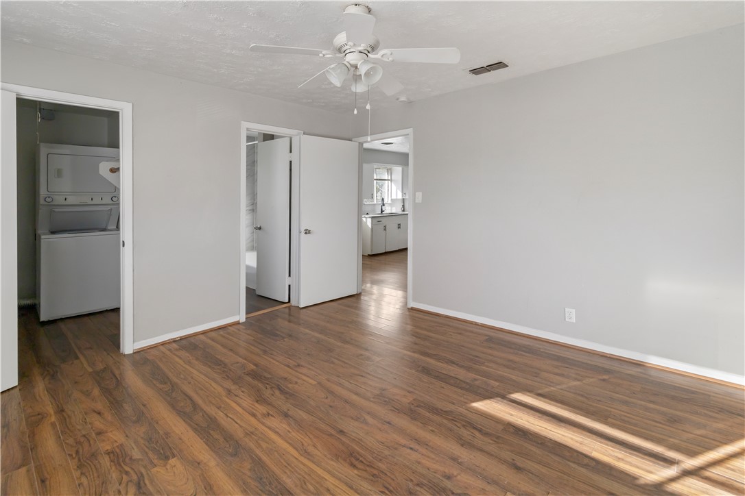 1012-1014 East 23rd Street Bryan, TX 77803 - Photo 15 of 22 wooden floor in an empty room with a window
