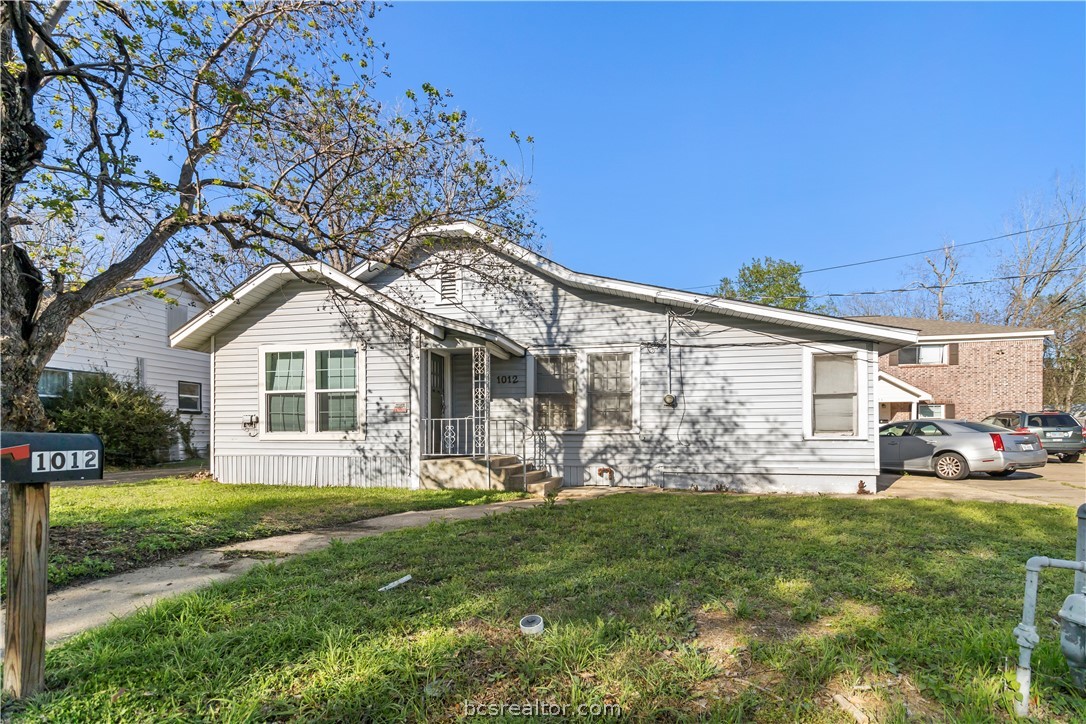 1012-1014 East 23rd Street Bryan, TX 77803 - Photo 3 of 22 a front view of house with yard and green space