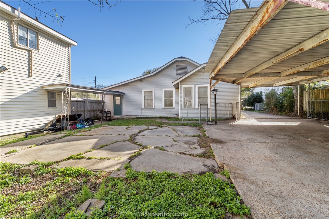 1012-1014 East 23rd Street Bryan, TX 77803 - Photo 6 of 22 a front view of a house with a garden and pathway