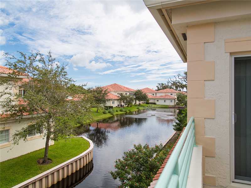 576 7th Square Southwest, Unit 202 Vero Beach, FL 32962 - Photo 2 of 28 a view of a lake from a balcony