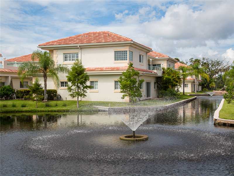 576 7th Square Southwest, Unit 202 Vero Beach, FL 32962 - Photo 23 of 28 a view of a house with a yard