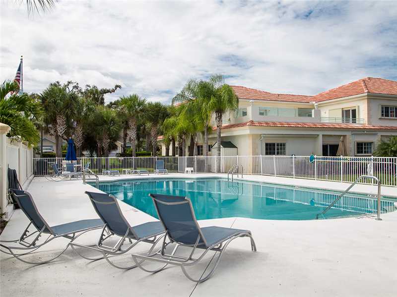 576 7th Square Southwest, Unit 202 Vero Beach, FL 32962 - Photo 24 of 28 a view of house with backyard outdoor seating and barbeque oven