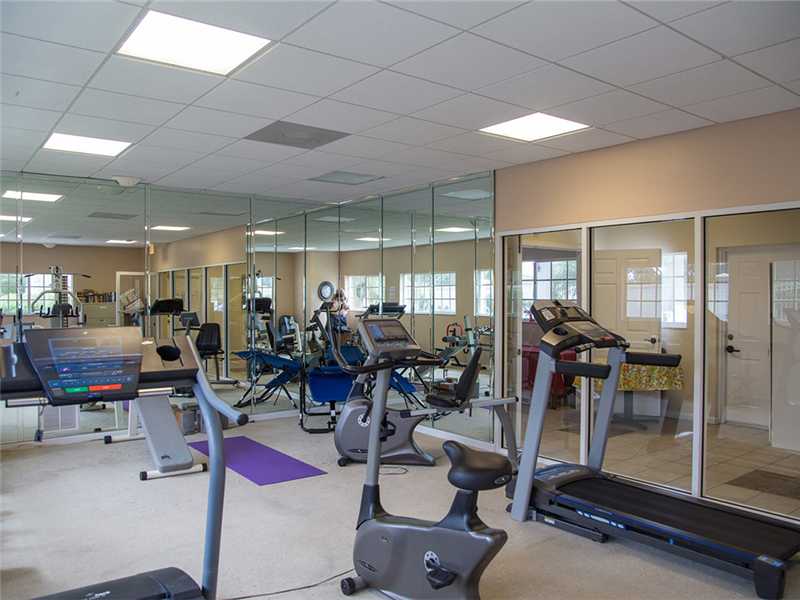 576 7th Square Southwest, Unit 202 Vero Beach, FL 32962 - Photo 26 of 28 a view of a room with gym equipment