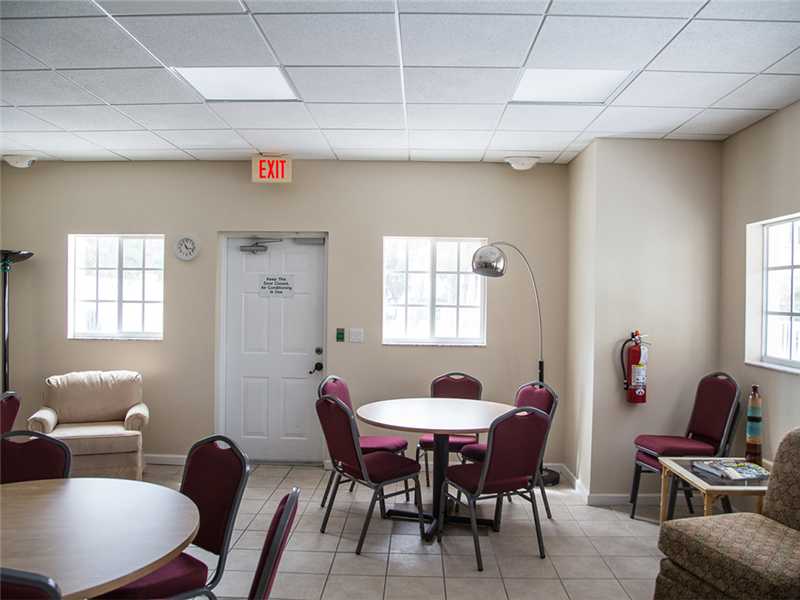 576 7th Square Southwest, Unit 202 Vero Beach, FL 32962 - Photo 27 of 28 a view of a dining room with furniture and window
