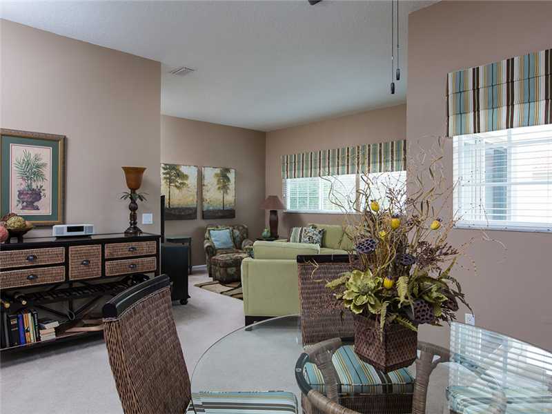 576 7th Square Southwest, Unit 202 Vero Beach, FL 32962 - Photo 10 of 28 a living room with furniture and a window
