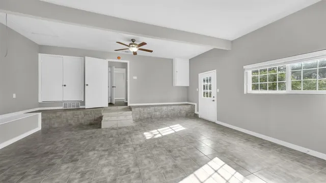 a view of an empty room with a window