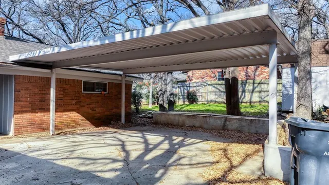 a view of a shaded area in a backyard