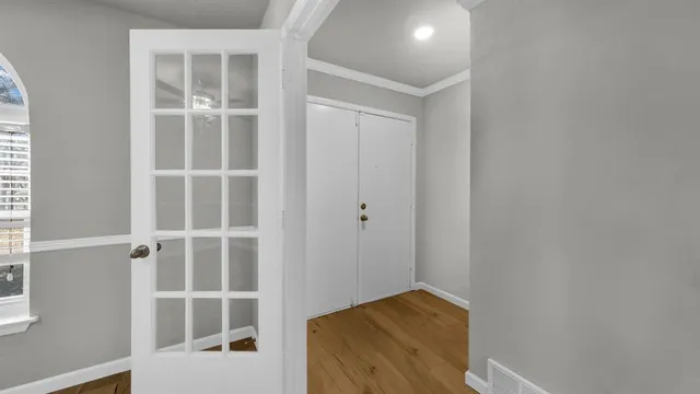 a view of walk in closet with empty racks