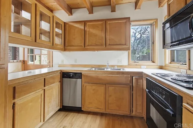 a kitchen with stainless steel appliances granite countertop a stove and a sink