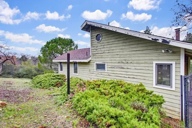 a backyard of a house with lots of green space