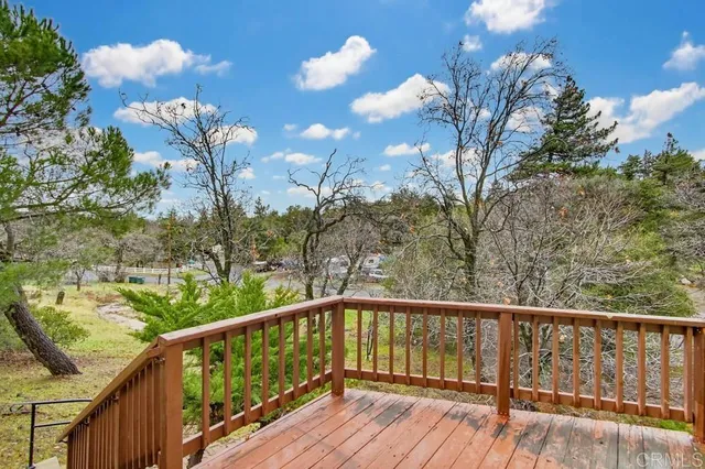 a view of balcony with wooden floor