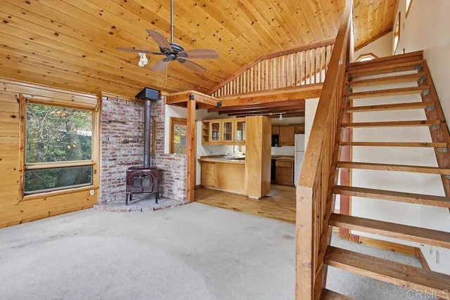 a view of an empty room with a fireplace