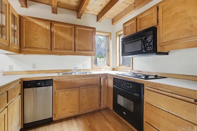 a kitchen with stainless steel appliances granite countertop a stove and a sink