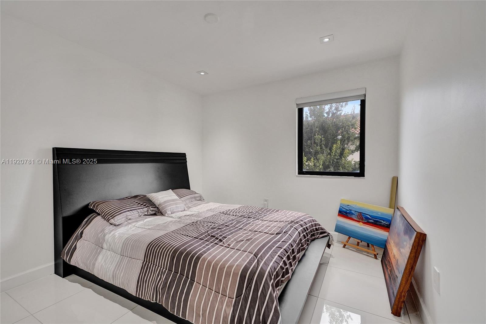 377 Northeast 194th Terrace Miami, FL 33179 - Photo 14 of 19 a bedroom with bed and cupboard