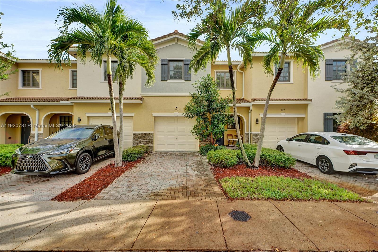 377 Northeast 194th Terrace Miami, FL 33179 - Photo 2 of 19 a view of a cars parked in front of a house