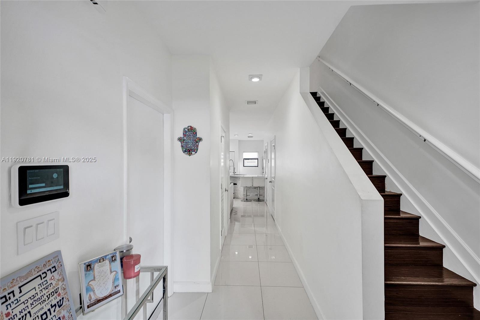 377 Northeast 194th Terrace Miami, FL 33179 - Photo 3 of 19 a view of entryway and hall with wooden floor
