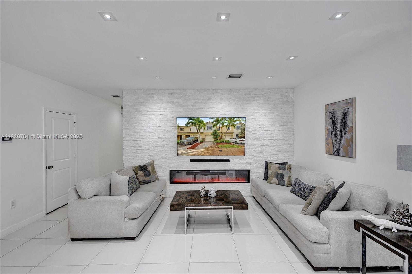 377 Northeast 194th Terrace Miami, FL 33179 - Photo 7 of 19 a living room with furniture and a couch