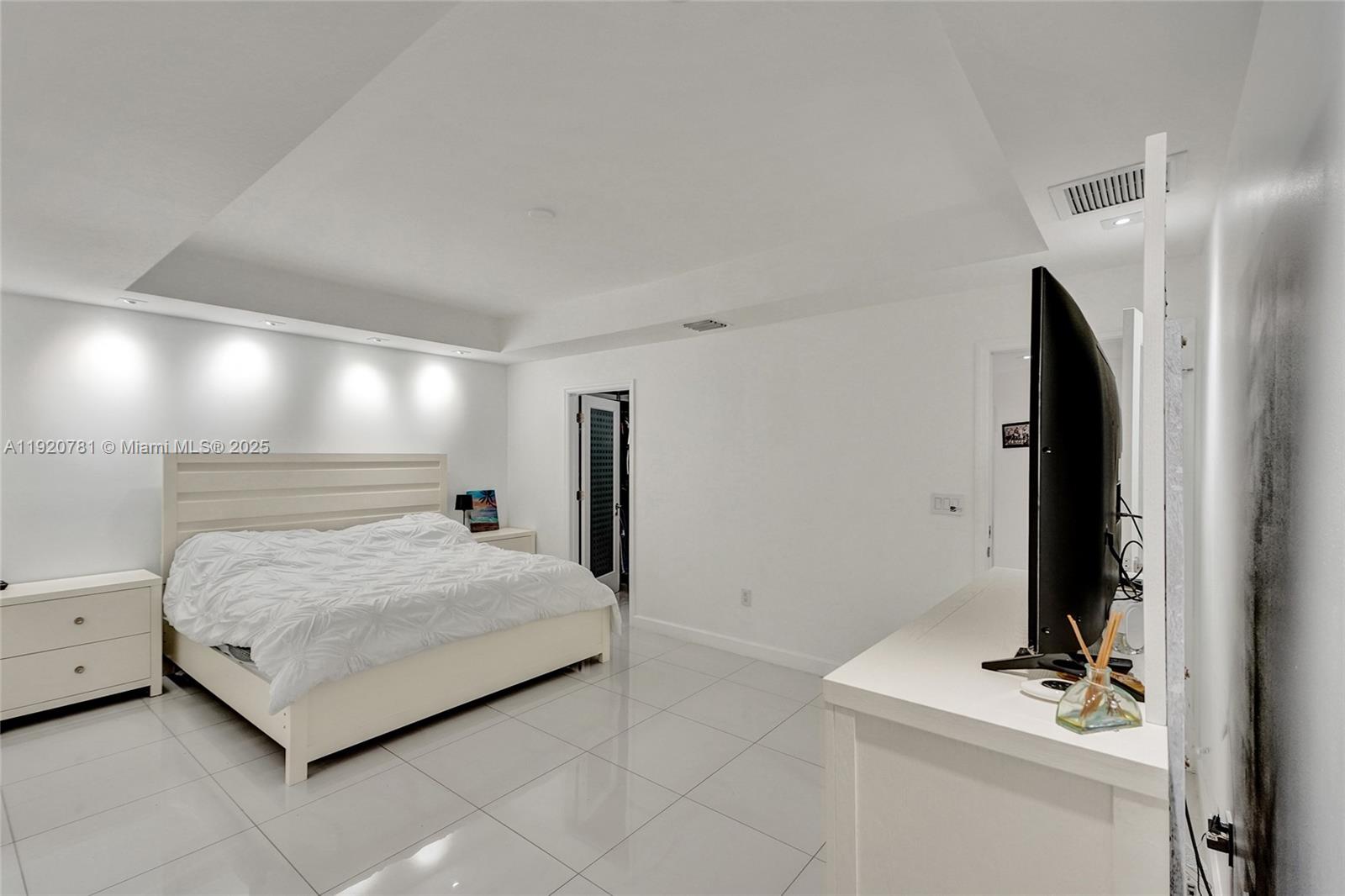 377 Northeast 194th Terrace Miami, FL 33179 - Photo 10 of 19 a bedroom with a bed and a bathroom