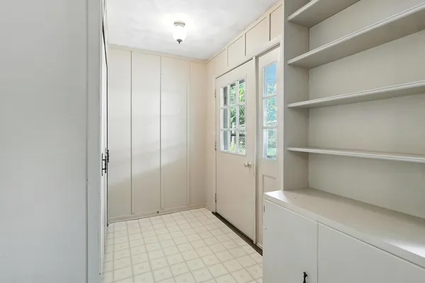 a view of an empty room with a window