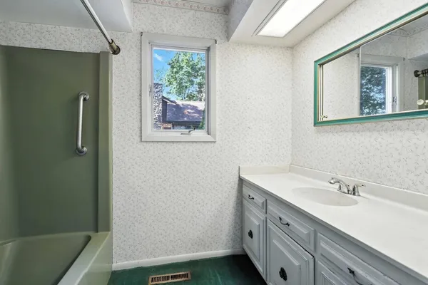 a kitchen with a sink stove and microwave