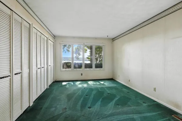 a view of a hallway with entryway door