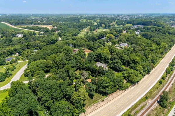 a view of a swimming pool with a yard