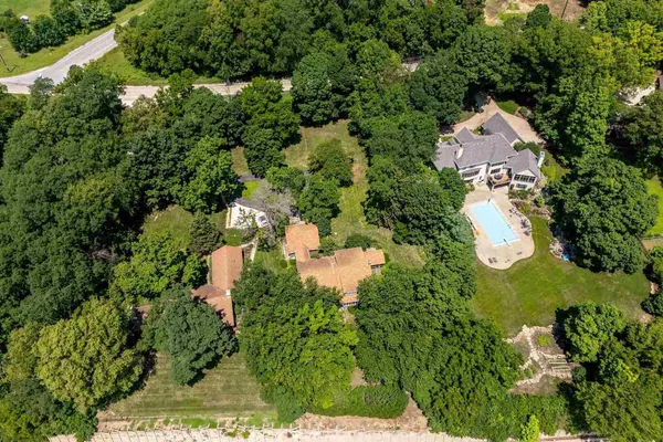 a view of a yard with swimming pool