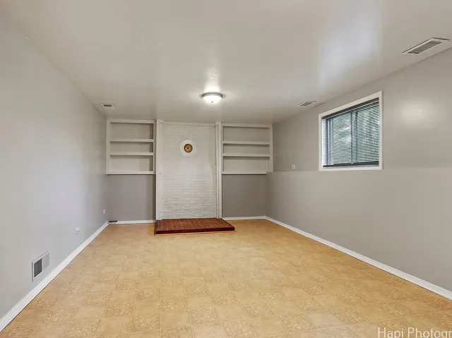 a view of an empty room with a window