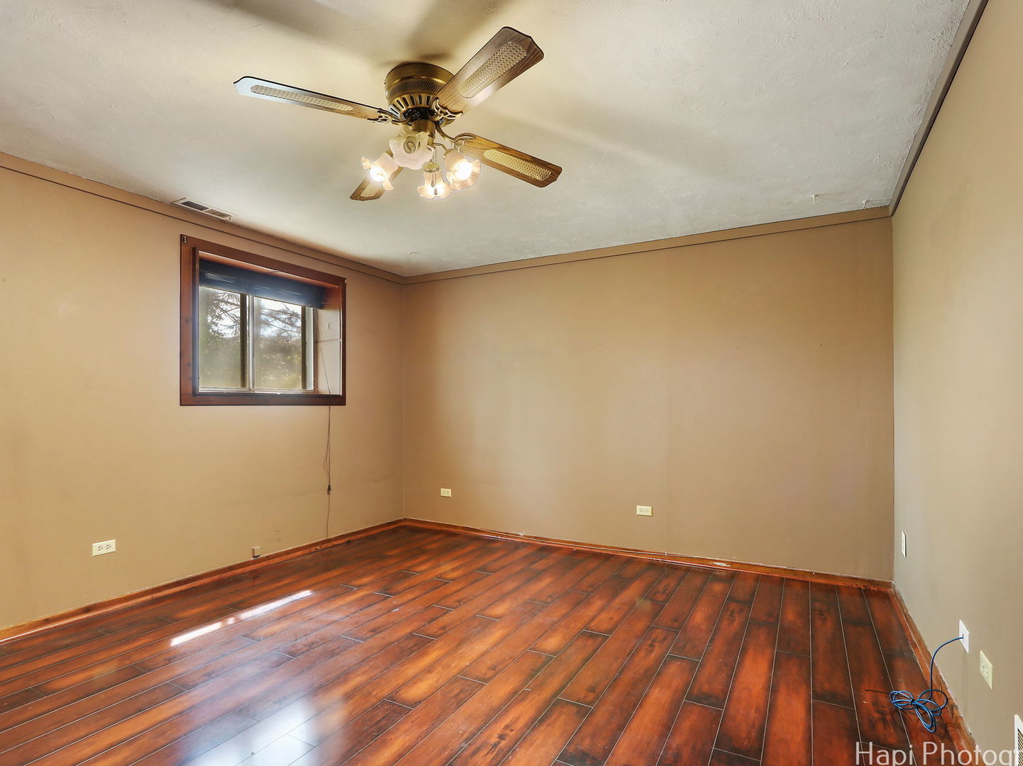 1291 Banbury Road Mundelein, IL 60060 - Photo 17 of 22 a view of an empty room with wooden floor and a window