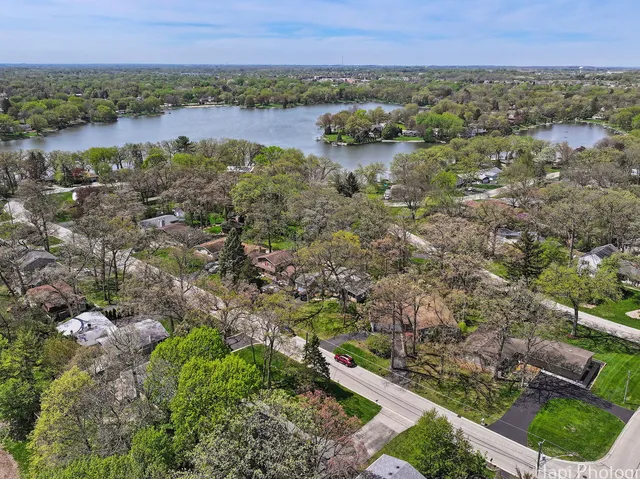 a view of a lake with houses in the back