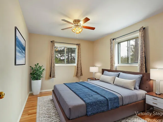 a bedroom with a large bed and a window