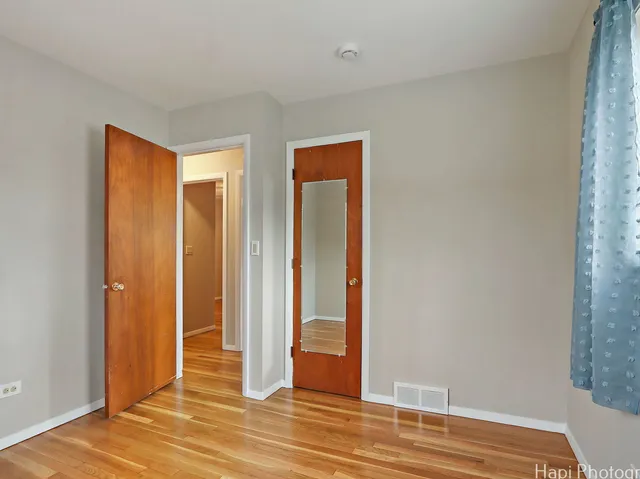 a view of entryway with wooden floor