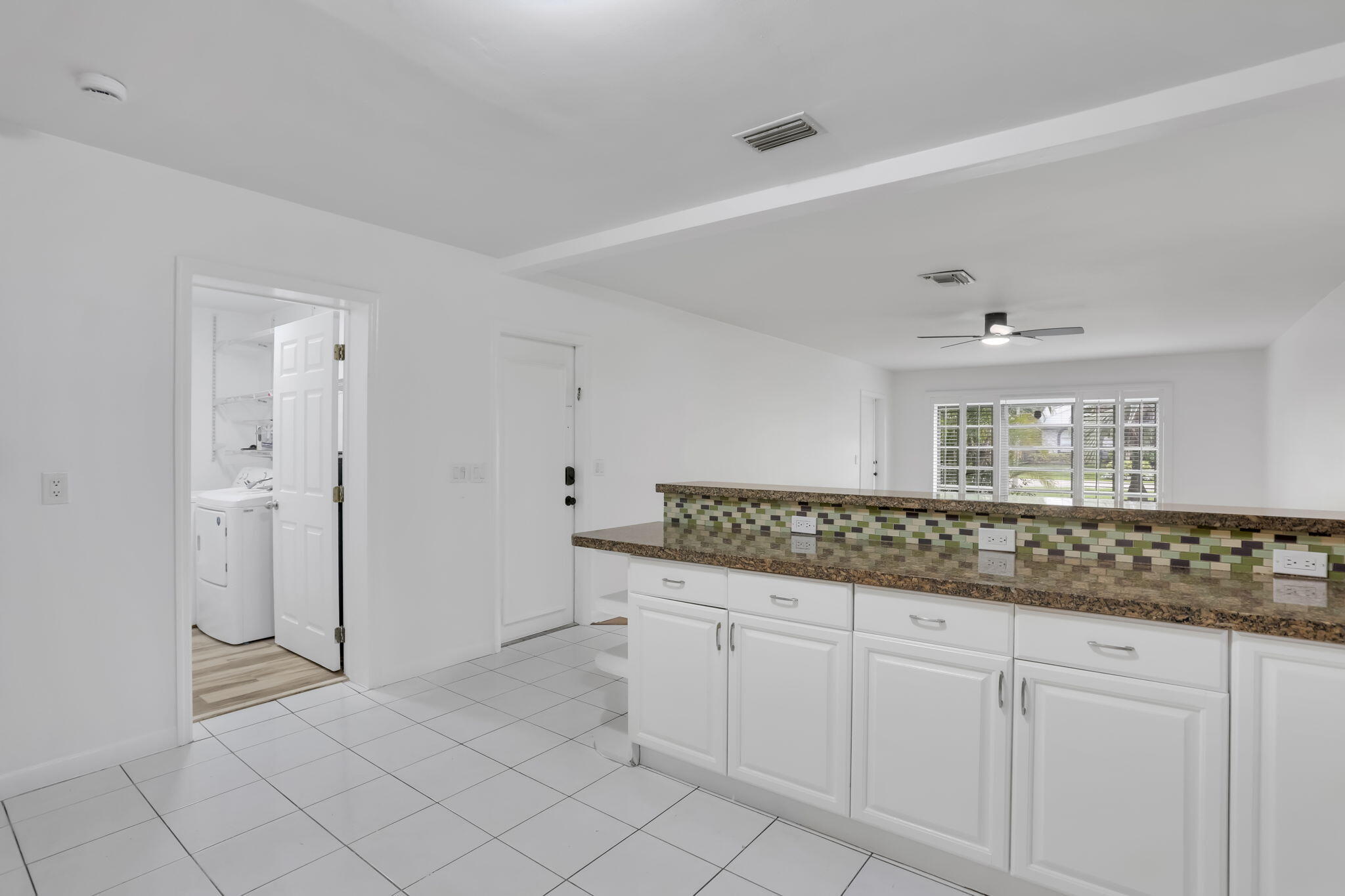 631 Bailey Street Boca Raton, FL 33487 - Photo 11 of 31 a bathroom with a granite countertop sink mirror and cabinets