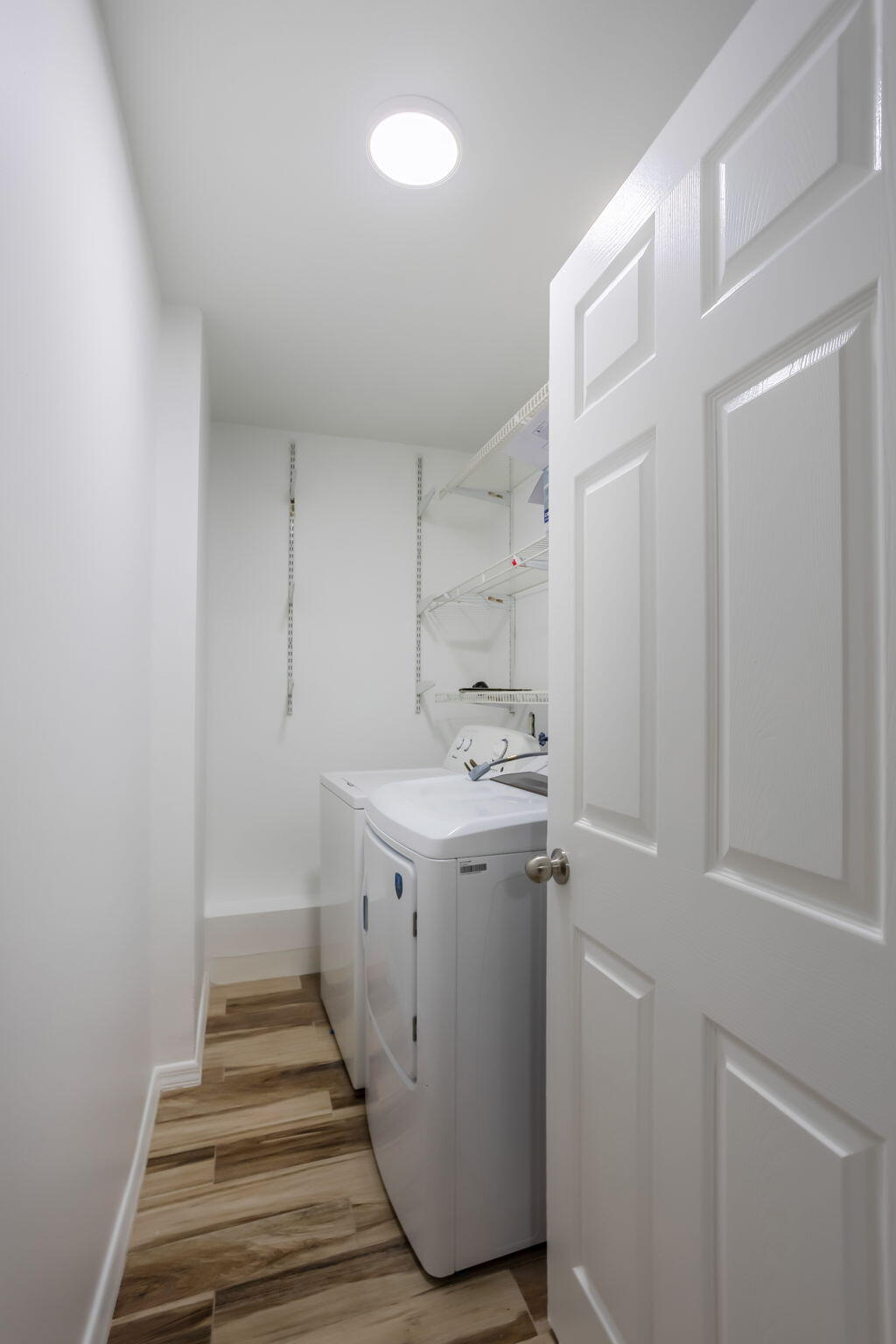 631 Bailey Street Boca Raton, FL 33487 - Photo 12 of 31 a utility room with cabinets washer and dryer