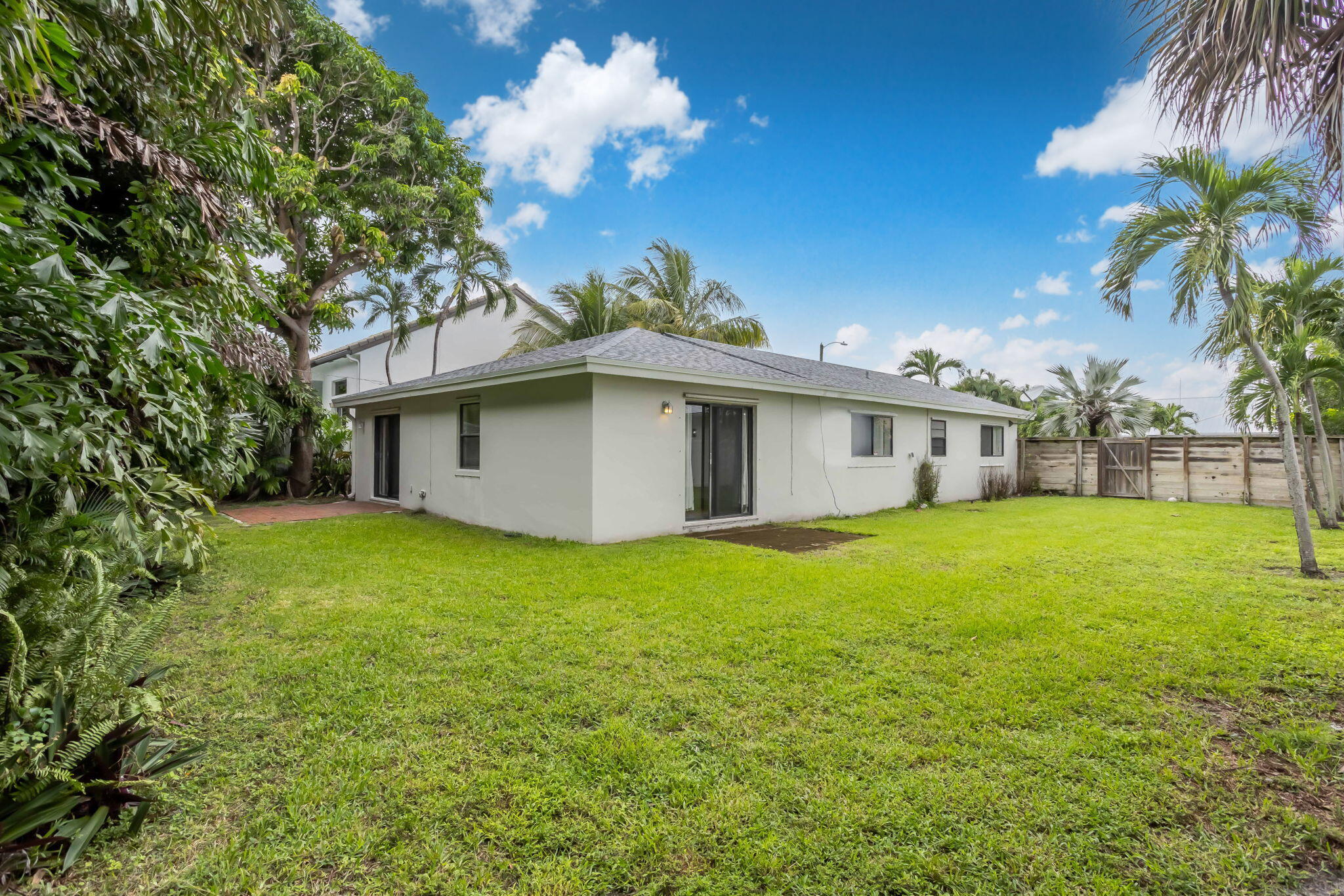 631 Bailey Street Boca Raton, FL 33487 - Photo 17 of 31 a view of a house with backyard and garden