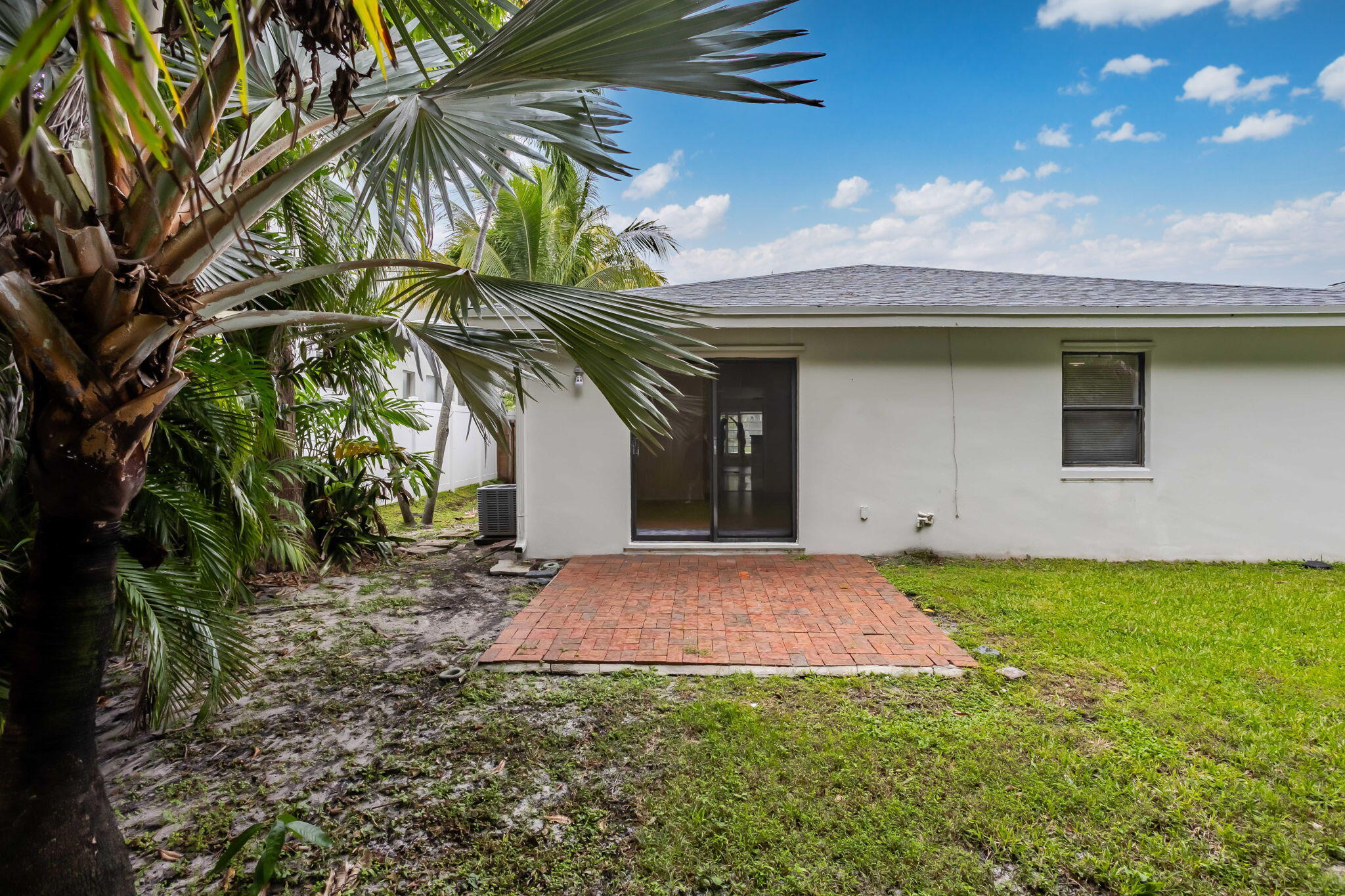 631 Bailey Street Boca Raton, FL 33487 - Photo 22 of 31 a view of a house with a yard