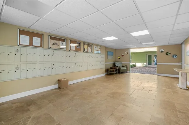 a room with a bed and a large window