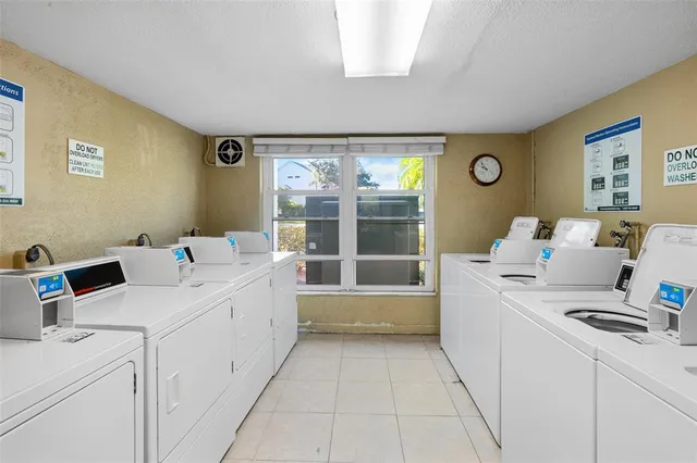 a front view of a house with plants