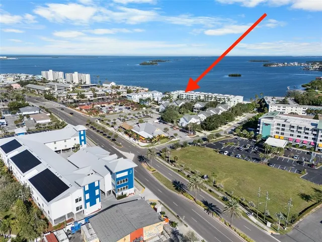 an aerial view of a house with a swimming pool