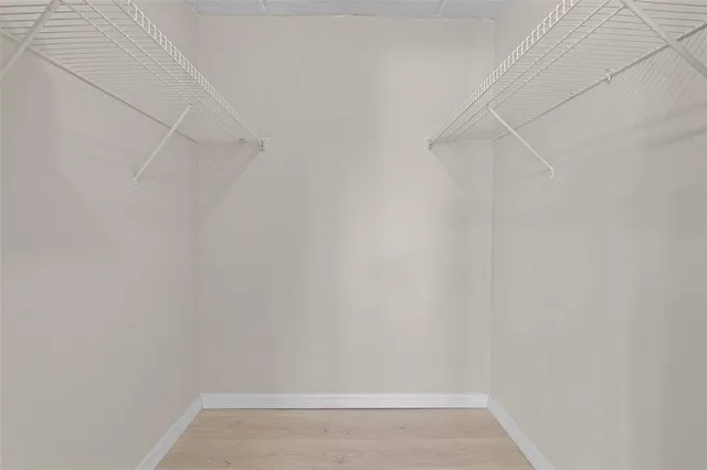 a bathroom with a sink toilet vanity and bathtub