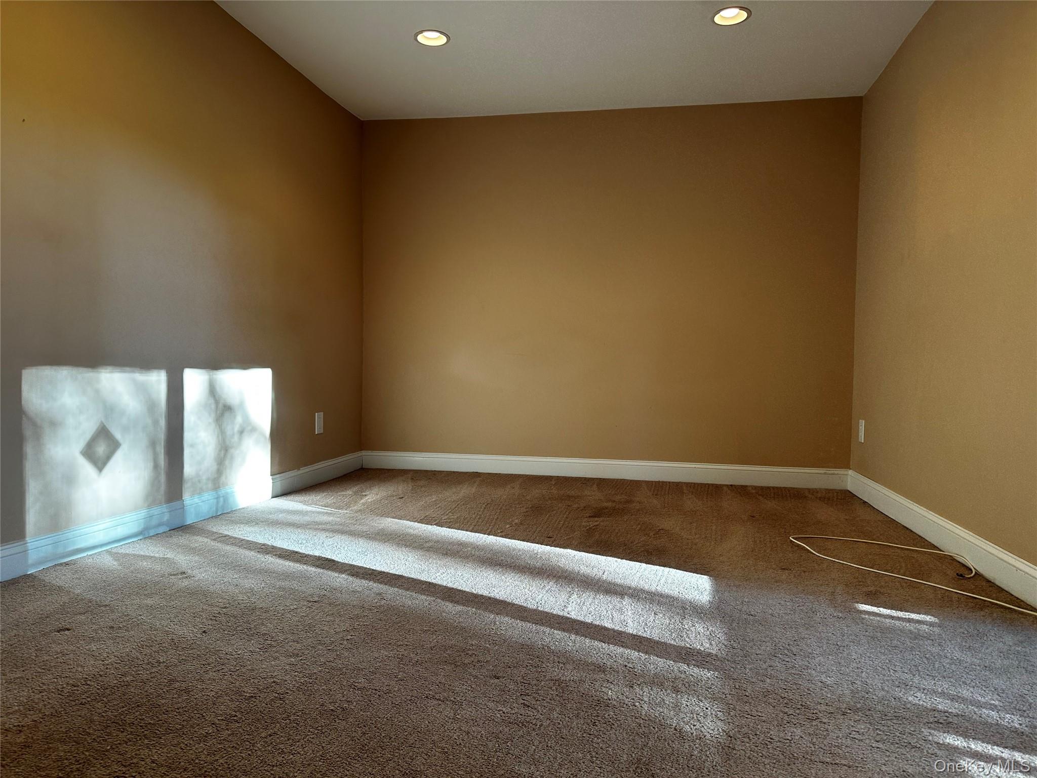 83 Bailey Court, Unit 83 Middle Island, NY 11953 - Photo 8 of 13 a view of an empty room with a window