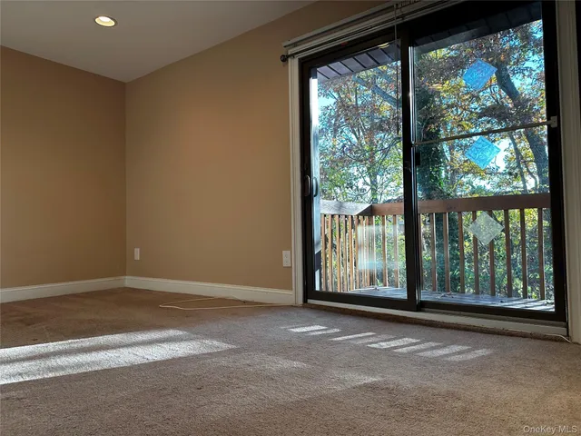 a view of a room with large windows