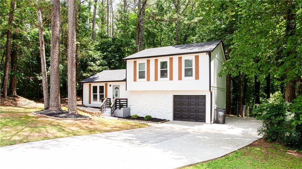 a front view of a house with a garage