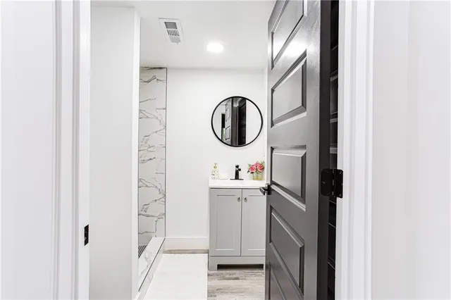 a bathroom with a toilet and shower